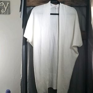 Knee length cream cardigan.  Short sleeve